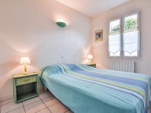 Łóżko lub łóżka w pokoju w obiekcie Modern Holiday Home in Sainte-Marie-de-Re near Sea