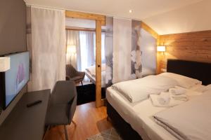 Llit o llits en una habitació de Dà Ingo - Apartments & More