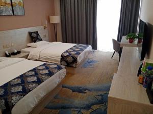 Кровать или кровати в номере Demei Boutique Hotel