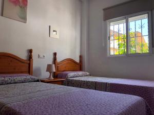 En eller flere senge i et værelse på Apartamento Triana l Bolonia, Tarifa