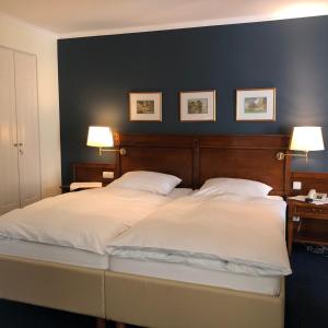 Ein Bett oder Betten in einem Zimmer der Unterkunft Hotel Scherf