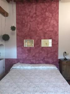 Postel nebo postele na pokoji v ubytování La Locanda del Loggiato