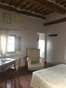 Postel nebo postele na pokoji v ubytování La Locanda del Loggiato