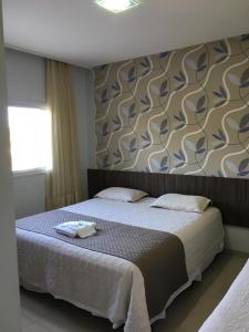 Ένα ή περισσότερα κρεβάτια σε δωμάτιο στο Premier Pallace Hotel