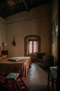 Postel nebo postele na pokoji v ubytování La Locanda del Loggiato
