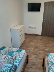 Postel nebo postele na pokoji v ubytování U Matěje