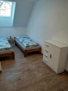 Postel nebo postele na pokoji v ubytování U Matěje