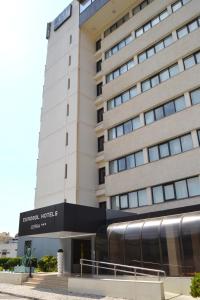 a building with a train in front of it at Hotel Eurosol Leiria & Jardim in Leiria