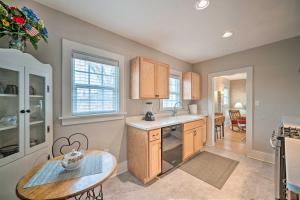 a kitchen with a sink and a table in it at Well-equipped Cody Cottage 2 Miles to Cody Rodeo! in Cody