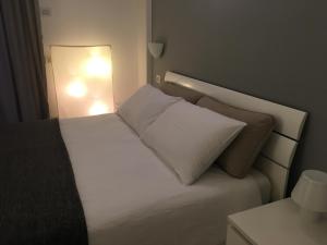 Ένα ή περισσότερα κρεβάτια σε δωμάτιο στο Civico6