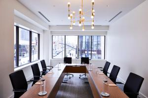 a large conference room with a long table and chairs at Noelle in Nashville