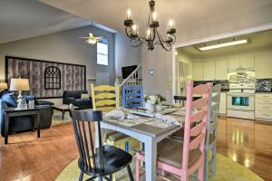 a dining room and living room with a table and chairs at Pinehurst Condo about 2 Miles to Downtown and Resort! in Pinehurst