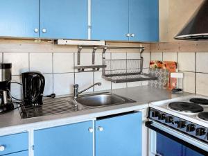 A kitchen or kitchenette at 4 person holiday home in ELL S