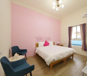 Posteľ alebo postele v izbe v ubytovaní Hengchun Inn