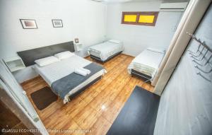 Cama ou camas em um quarto em IguassuEcoHostel - Eco Suítes - Hostel mais próximo das Cataratas