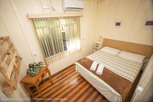 Cama ou camas em um quarto em IguassuEcoHostel - Eco Suítes - Hostel mais próximo das Cataratas