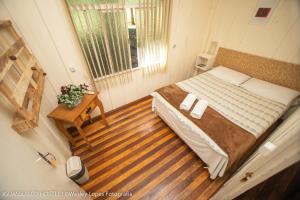Cama ou camas em um quarto em IguassuEcoHostel - Eco Suítes - Hostel mais próximo das Cataratas
