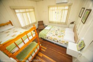 Cama ou camas em um quarto em IguassuEcoHostel - Eco Suítes - Hostel mais próximo das Cataratas