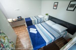Cama ou camas em um quarto em IguassuEcoHostel - Eco Suítes - Hostel mais próximo das Cataratas