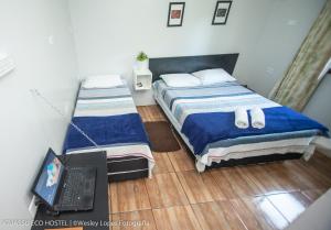 Cama ou camas em um quarto em IguassuEcoHostel - Eco Suítes - Hostel mais próximo das Cataratas