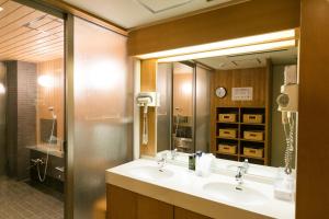 a bathroom with two sinks and a large mirror at Kyonoyado Kagihei in Kyoto +26 photos