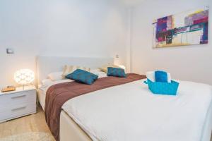 Posteľ alebo postele v izbe v ubytovaní Villa Mlini with private Pool and Sea view + 32 fotografií