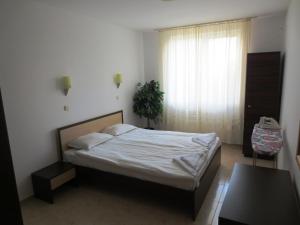 Ένα ή περισσότερα κρεβάτια σε δωμάτιο στο Breeze Apartment Complex +29 φωτογραφίες