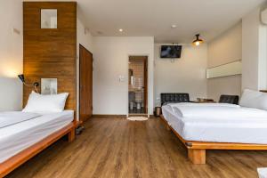 En eller flere senger på et rom på Mini Voyage Hostel
