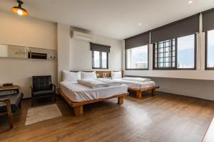En eller flere senger på et rom på Mini Voyage Hostel
