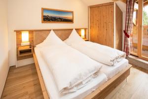 Кровать или кровати в номере Chiemsee Hauszeit