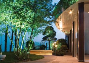 an exterior view of a house with trees and lights at Luxury for business & pleasure Royal 1 in Kyiv