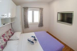 Postel nebo postele na pokoji v ubytování Apartments Anita + 37 fotografií