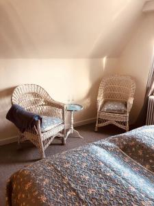 Postel nebo postele na pokoji v ubytování Den Gamle Apotekergaard