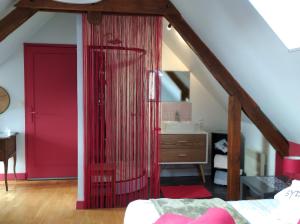 A bed or beds in a room at B&B Ferme de La Rouzannerie pour 2 ou famille