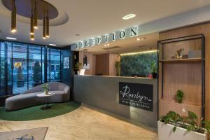 a reception area of a hotel with a reception desk at Rosslyn Thracia Hotel Sofia in Sofia