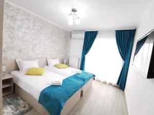 Кровать или кровати в номере Otopeni Comfort Apartaments