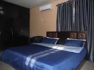 Katil atau katil-katil dalam bilik di StayCation Suites And Apartment