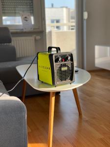 a yellow and black radio sitting on a table at Apartament F&J #35 in Toruń