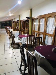 a row of tables and chairs in a restaurant at HOTEL JERICO in Zamora de Hidalgo