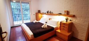 Postel nebo postele na pokoji v ubytování VILLAS COSETTE - Villa Julieta