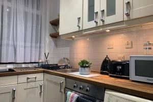 A kitchen or kitchenette at City STAY