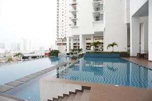 a swimming pool on the roof of a building at Pinnacle Tower Homestay by Home Cube in Johor Bahru