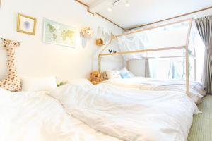 Letto o letti in una camera di 一棟貸切宿, HARMONIA東京小岩 6名max,wifi有,秋葉原16分新宿33分,ディズニー電車48分, 駐車場ありません