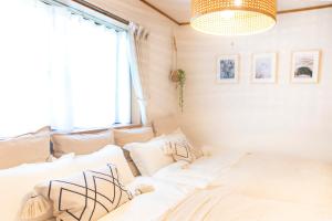 Letto o letti in una camera di 一棟貸切宿, HARMONIA東京小岩 6名max,wifi有,秋葉原16分新宿33分,ディズニー電車48分, 駐車場ありません