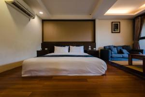 Ein Bett oder Betten in einem Zimmer der Unterkunft Zhou Ye Cottage