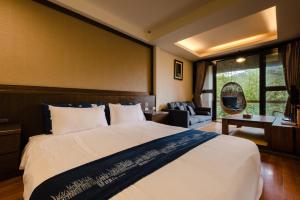 Ein Bett oder Betten in einem Zimmer der Unterkunft Zhou Ye Cottage