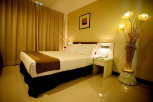 Katil atau katil-katil dalam bilik di Mangga Boutique Hotel