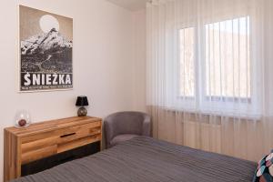 Posteľ alebo postele v izbe v ubytovaní Apartamenty Wczasowa