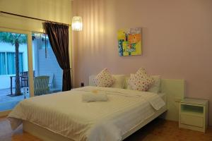 Ліжко або ліжка в номері Clear House Phuket