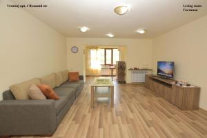 a living room with a couch and a table at Vernisaj apt at Republic Square & Ruben tours in Yerevan